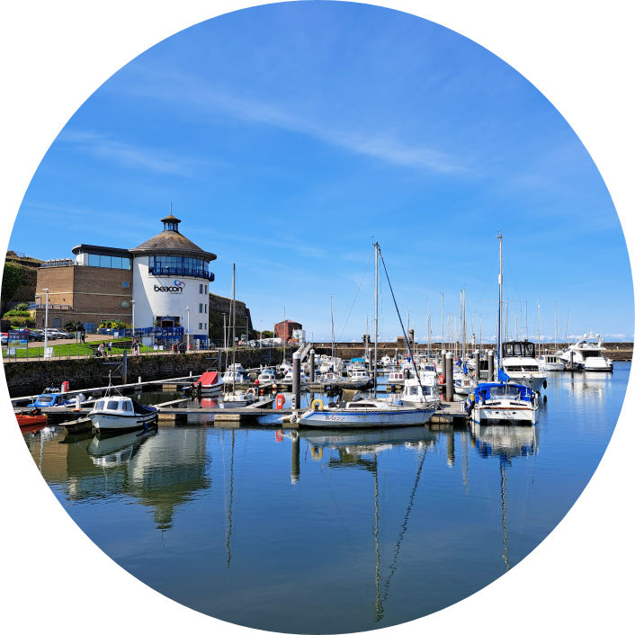Whitehaven harbour, with boats floating in the water 